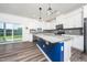 Modern kitchen features granite countertops, stainless appliances, and a large island at 171 Piney Field Rd, Fuquay Varina, NC 27526