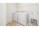 Well-lit laundry room with tile floor, Maytag washer and dryer, and sink at 171 Piney Field Rd, Fuquay Varina, NC 27526