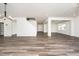 Open living room showcasing hardwood floors, neutral walls, and an open floor plan at 171 Piney Field Rd, Fuquay Varina, NC 27526