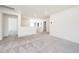 View of the carpeted loft area with staircase and access to multiple rooms at 171 Piney Field Rd, Fuquay Varina, NC 27526