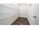 Spacious pantry features metal shelving and laminate flooring, offering ample storage at 171 Piney Field Rd, Fuquay Varina, NC 27526
