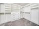 Walk-in closet with custom built-in shelving and drawers providing tons of storage at 171 Piney Field Rd, Fuquay Varina, NC 27526