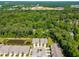 Stunning aerial view of a neighborhood with lush trees, serene ponds and a community water tower at 192 Glenpark Pl, Cary, NC 27511