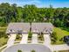 Overhead view of townhomes with manicured landscaping and mature trees surrounding the neighborhood at 192 Glenpark Pl, Cary, NC 27511