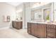 Spacious bathroom featuring double vanities with granite countertops, ample lighting, and tile floors at 192 Glenpark Pl, Cary, NC 27511