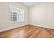 Bedroom features neutral paint and a bright window at 192 Glenpark Pl, Cary, NC 27511