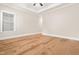 Empty bedroom featuring hardwood floors, neutral paint and an abundance of natural light at 192 Glenpark Pl, Cary, NC 27511