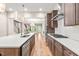 Modern kitchen featuring a center island, stainless steel appliances, pendant lighting, and hardwood floors at 192 Glenpark Pl, Cary, NC 27511
