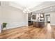 Open floor plan showcasing the kitchen and dining area with hardwood flooring and designer finishes at 192 Glenpark Pl, Cary, NC 27511