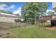 A spacious backyard with a wooden fence, a hammock, and a deck, perfect for outdoor living and entertaining at 201 Crossfire Rd, Holly Springs, NC 27540
