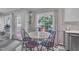 Bright breakfast nook area with a table, four chairs, and a view of the backyard at 201 Crossfire Rd, Holly Springs, NC 27540