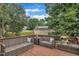 Inviting outdoor deck with comfortable seating, perfect for relaxation and enjoying the scenic views at 201 Crossfire Rd, Holly Springs, NC 27540