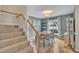 Bright dining area with hardwood floors, a large window, and a charming light fixture at 201 Crossfire Rd, Holly Springs, NC 27540