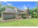 Spacious backyard showcasing a wooden deck and lush green lawn at 201 Village Dr, Knightdale, NC 27545