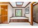 Spacious bathroom featuring a soaking tub with wooden trim and a window view at 201 Village Dr, Knightdale, NC 27545