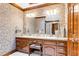 Bathroom with double vanity, elegant wallpaper, and beautiful lighting at 201 Village Dr, Knightdale, NC 27545