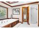 Bathroom featuring a soaking tub, walk-in shower, and natural light at 201 Village Dr, Knightdale, NC 27545