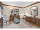 Well-lit bedroom featuring wood furniture, cozy seating, and elegant decor at 201 Village Dr, Knightdale, NC 27545