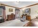 Versatile bedroom with classic wood trim, soft carpet, and a comfortable sitting area at 201 Village Dr, Knightdale, NC 27545
