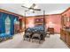 Spacious bedroom with four poster bed, ceiling fan, and pink walls at 201 Village Dr, Knightdale, NC 27545