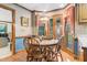 Cozy breakfast nook with a round table, wood chairs, and lots of natural light at 201 Village Dr, Knightdale, NC 27545