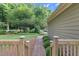 Brick path and lush greenery seen from the back deck at 201 Village Dr, Knightdale, NC 27545