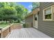 Back deck leading to a manicured yard at 201 Village Dr, Knightdale, NC 27545