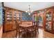 Dining room with a large china cabinet, chandelier, and wood table at 201 Village Dr, Knightdale, NC 27545
