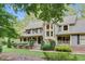 Charming two-story home with a welcoming front porch, well-maintained landscaping, and a classic design at 201 Village Dr, Knightdale, NC 27545
