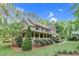 Charming two-story home with covered porch and nicely landscaped yard in a peaceful setting at 201 Village Dr, Knightdale, NC 27545