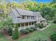 Beautiful home with a covered front porch and lush landscaping at 201 Village Dr, Knightdale, NC 27545