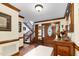 Spacious foyer with a staircase, hardwood floors, and a decorative stained glass window at 201 Village Dr, Knightdale, NC 27545