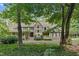 Charming two-story home with a bay window, landscaped yard, and covered porch at 201 Village Dr, Knightdale, NC 27545