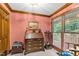 Charming office with a wooden desk, trim, and a large window at 201 Village Dr, Knightdale, NC 27545