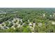 Scenic aerial view of a residential neighborhood with tree-lined streets near the water at 202 Hilltop Ave, Garner, NC 27529