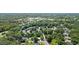 Stunning aerial view of a lush, tree-filled neighborhood featuring an array of rooftops at 202 Hilltop Ave, Garner, NC 27529