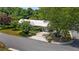 Aerial view of a landscaped property with mature trees and a metal roof at 202 Hilltop Ave, Garner, NC 27529