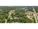 Aerial view of a neighborhood street intersection with mature trees and roadway at 202 Hilltop Ave, Garner, NC 27529