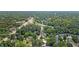 Expansive aerial view of a residential neighborhood with mature trees and streetscapes at 202 Hilltop Ave, Garner, NC 27529