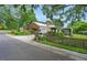 Charming home with a manicured lawn, inviting curb appeal, mature trees and a fenced yard at 202 Hilltop Ave, Garner, NC 27529