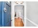 Entryway with hardwood floors and blue front door featuring a decorative door knocker at 202 Hilltop Ave, Garner, NC 27529