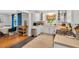 Bright kitchen features white cabinets, stainless steel appliances, and a tile backsplash at 202 Hilltop Ave, Garner, NC 27529