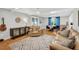 Inviting living room with a cozy leather chair and hardwood floors at 202 Hilltop Ave, Garner, NC 27529