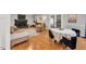 Cozy living room featuring hardwood floors, a brick fireplace, and neutral furniture at 202 Hilltop Ave, Garner, NC 27529