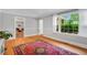 Hardwood floors and gray walls create a comfortable, bright living space at 202 Hilltop Ave, Garner, NC 27529