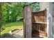 A private outdoor shower adjacent to a grassy yard and mature trees at 202 Hilltop Ave, Garner, NC 27529