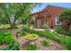 Inviting patio area with a charming pergola, swing and lush landscaping, perfect for relaxing outdoors at 202 Hilltop Ave, Garner, NC 27529