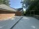 Large backyard deck with brick house siding with outdoor wooded views at 2032 Sherry Lynn Dr, Garner, NC 27529