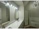 Renovated bathroom featuring dual vanity, gold fixtures, and separate bathtub at 2032 Sherry Lynn Dr, Garner, NC 27529