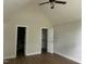 Vaulted bedroom with wood-look floors, walk-in closet, and connecting bathroom at 2032 Sherry Lynn Dr, Garner, NC 27529